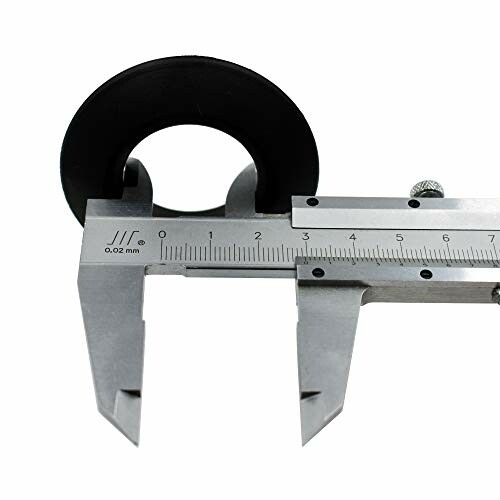 Caliper measuring a round black object