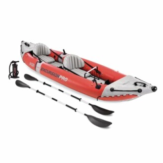 Red inflatable kayak with paddles and pump