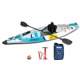 Inflatable kayak with paddle, pump, and carry bag.