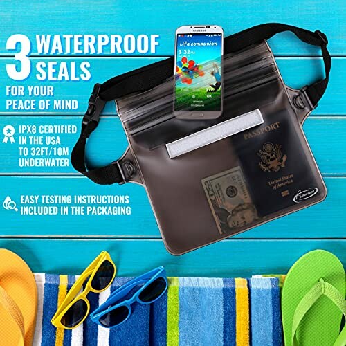 Waterproof pouch with phone, passport, and money inside, next to beach accessories.